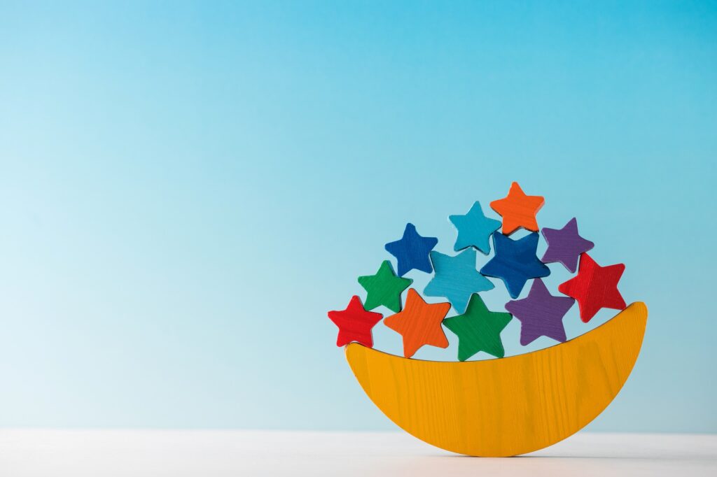 Children's wooden educational toy balancer in the form of a month and stars. Montessori toys.